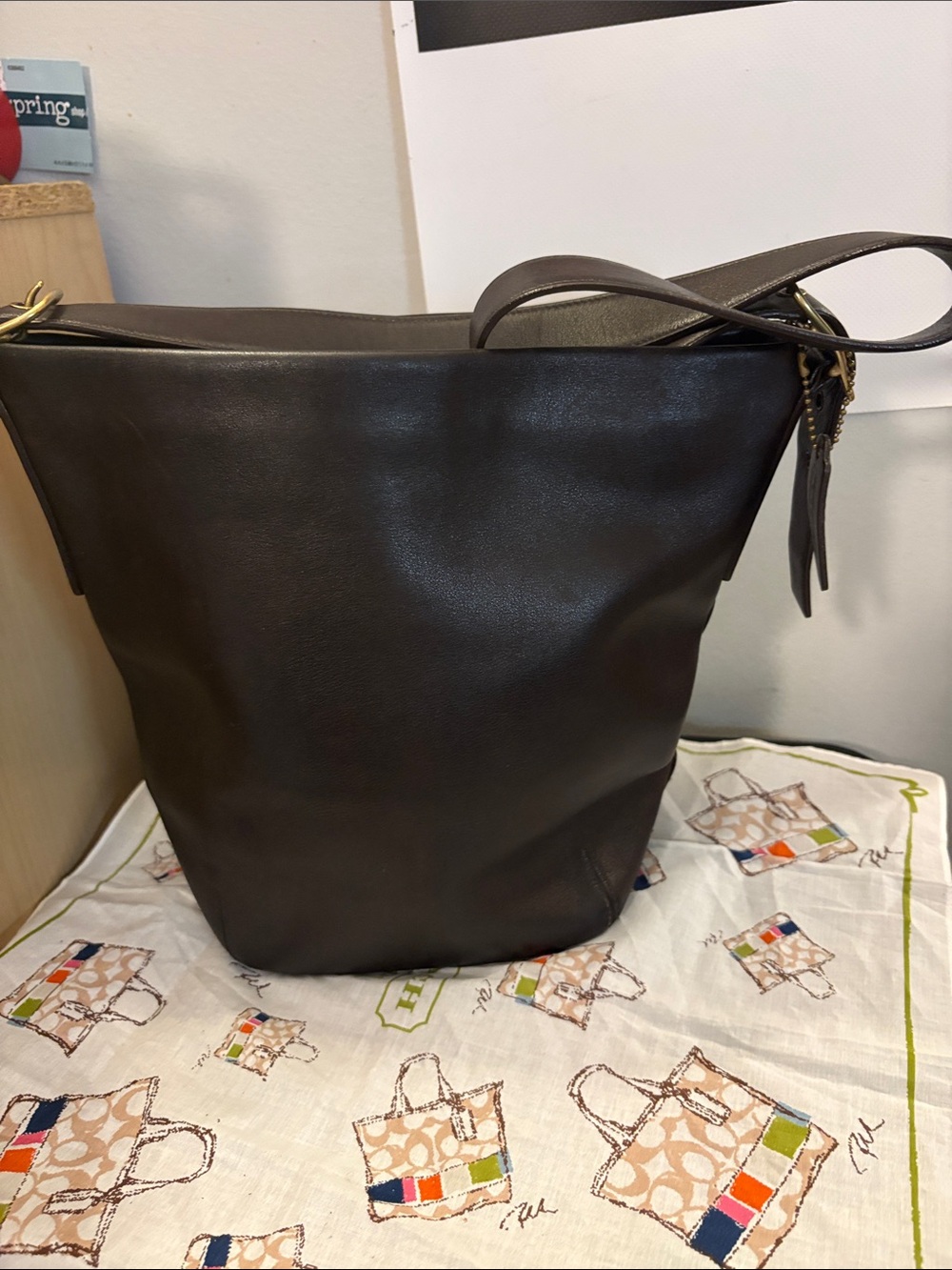 vintage Coach 1992 Duffle Sac bucket bag crafted from dark leather with classic